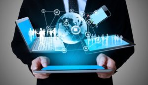 A person holding an ipad with a world map on it.