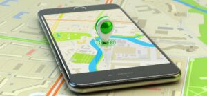 A phone with a green pin on it